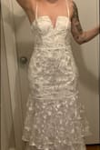 Its a gorgeous dress, but itt had a lot of misteps. The zipper is awful, it gets stuck every time. Its a size small but barely hugs my hips at all. The front is not flattering and gives me a "baby bump" which I dont have, nor would not want for a wedding. Im not that shapely of a person but it gives me huge hips - Hana P.