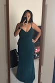 I love this dress! Planning to wear it to a wedding. I was scared I was gonna need to buy a bra that wouldn't show, but it gives me enough support so no bra needed. Nice stretchy material that hugs me just right. Just a tiny bit long but not sure yet what shoes I'm wearing. - Janna P.