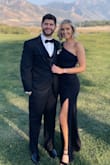 The dress fit true to size and had a little stretch. The fabric and fit was comfortable to wear all night and dance in. - Kelsy P.
