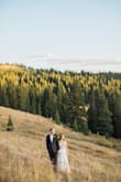 My husband proposed to me on 24th, 2020 while we hiked in the mountains of Breckenridge, CO. We decided our wedding would be exactly one year later; September 24th, 2021. A week before our wedding, COVID threw us a curve ball. We chose to post-pone our original plans and took a vacation instead. We rented a camper van in Denver and began the best road trip of our lives. I left my original wedding dress back home and ordered this dress from Lulus. I had it shipped to a friends house in Colorado. If it fit perfectly, we decided wed elope, if not, wed wait until next year to get married at our postponed wedding. 
Well the dress fit PERFECTLY! I paired it with my hiking boots and we returned to the same mountain trail where I originally said "YES!" to exchange our vows. The day was absolutely beautiful, filled with nothing but laughter and happy tears.  And the photos are truly stunning! - Hayley R.