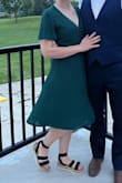 I wore this dress to a wedding and it fit perfectly! I was a bit worried about it being too low cut, but it had good coverage and felt secure throughout the day. It did take a bit of ironing to get the wrinkles out from being in the package, but it looked beautiful after. Would highly recommend this dress! - Miriam V.