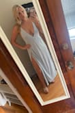 This beautiful dress has 2 slits that show just enough leg! I was nervous it might be too thin of material, but it's not.. it's perfect. Bra free and nude undies! - Elizabeth P.