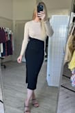 Ah I absolutely love this dress. It is classy, but also has a side slit and small cut-out detail for a little added sass. I tried on both the S and M- and while I could get away with wearing either size, I preferred the way the small hugged my curves a little more. This is definitely a sweater-type material- will keep you warm during colder weather! - Jessica D.