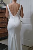 This fabric is really thick and lovely. It fit as if I had it tailored right away, and it has stretch in it too. The straps even have this little rubber lining so they don't slip at all, and it came with a quality garment bag. I cant believe how affordable it was- thank you! I ordered the XS and i usually wear a size 0/2 - Jackie O.