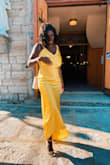 Dress is amazing. So many compliments. It looks so bright and beautiful under the sun. Make sure to steam it, to get the satin to fall correctly. - Aisha D.
