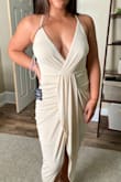 I absolutely adore this dress, it is flattering in every way. It accentuates my hips and it hugs just right, not too tight or uncomfortable at all. The only thing is that it's quite revealing in the chest area, and also it seems like more of an off-white/cream color to me rather than champagne. Other than that I'm absolutely in love! - Lauren H.