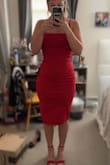 I absolutely love this dress. I bought to wear for a wedding reception. It hugs my curves in all the right places! The length and neck line are so flattering. The color is beautiful, it is the perfect true deep red which will look amazing on all skin tones since it is such a neutral red! Absolutely love love love, I can't wait to wear it! - Madison S.
