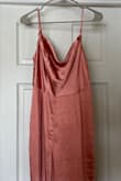 Wrong color and wrong style. This jumpsuit is a light dusty rose and doesn't have the fitted waistline and asymmetrical straps. - Beth J.