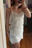 Love this dress so much! The beadwork is beautiful and is sewn on very well. Some of the tassels fell off but any dress with fringe is to be worn very carefully. Fits very well and is not too tight or too loose. Would recommend for anyone looking for a statement piece for a fun evening :) - Samantha W.
