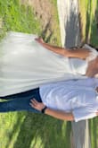 I bought this dress for getting married in the court and I got so many compliments. The dress made me feel like a princess. When I got the dress out of the back the tool needed to me messed with to calm it down and make it straight. But over all such a beautiful dress. - Heavyn H.