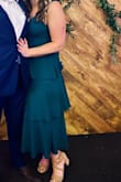 This dress was everything I needed for a formal wedding. It was a great length - hit about mid-shin. The waist was very flattering with the wider skirt. There is a hidden zipper up the side. I was able to wear a low sticky bra underneath the top to keep the girls in place. Very comfortable, true to size, and got a lot of compliments - Kristen W.