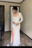 This dress is stunning. Ordered both small and xsmall. I'm 140lbs and the xsmall fit perfect. The slit is high like everyone else's review but it didn't bother me at all. It a bit thinner than some of the other Lulus long sleeve wedding dresses I ordered. It's so pretty! I did however go with a different dress from this site! I've tried 4 dress styles and they are all so pretty! - Jenna R.