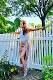 I honestly wasn't expecting to love this skirt as much as I did. The quality is excellent, the sashes for the wrap around waist are well made and secure and the material is soft and silky. I got so many compliments. Don't delay, buy it! 
The entire outfit (except the shoes) I am wearing is from Lulus. - Jeanette R.
