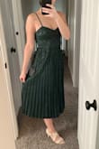 Lulus is my go-to for dresses. This is a great option for wedding guests. Fits like a glove, I got the XS. Fitted up top with adjustable straps- a must. The emerald color is stunning. Would definitely get it in other colors. Love the pleats! - Michelle L.