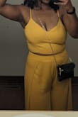 This fit me quite nicely and I felt really great in it. I got many compliments on the color and style! I did have to get the pants hemmed a couple of inches and I will say that for folks who have a large bust - this will be snug even with the adjustable straps. Because I had to adjust the straps for my chest they did slide off a couple of times but that did not really bother me at all.
For folks who are wary about the slit - it did open all the way up so I had to adjust and be aware of how the pants fell whenever I sat but it was really fun to wear! - Dannette L.