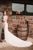 Nobody believed me when I told them it was $119. Fit like a glove- had my tailor add a bustle and a decorative belt for some bling, as well as sew-in cups. Stunning dress. Only cropped the first photo because the train needed to be shown in full display! - Aleigh H.