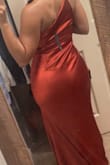 So I originally ordered a S and though it wasn't super big on me it was big enough (in the chest and waist area) that I would've had to get it altered. I took a leap of faith and decided to order a size down and it fit perfectly! My waist was snatched, it wasn't tight on my hips and my chest was properly secured lol It's a beautiful color and it does have some stretch, my only concern is that the zipper is on the size where the strap is which makes me concerned that it will snap since the strap is like a stretchy bra strap material. - Sheyenne D.