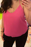 I ordered this top in pink and ivory during the Labor Day sale in a M (I'm typically a M in Lulus, occasionally a L) but exchanged for a L as the M was just a little too snug around my bust. These camis are loose and flowy, albeit a bit boxy in shape as they aren't very long. They are pretty low cut so not work appropriate but great for more casual occasions!
First photo is M - not as low cut, but it was so tight around my chest that the fabric was bunched up on my back.
Second photo is L - way more revealing but overall a more flattering and comfortable fit. - Tiffany S.