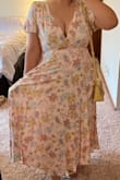 It fit very well, the fabric feels heavy and of good quality, and I think the pastel colors are beautiful. At first, I thought my chest would show too much but I just had to adjust the straps in the back. Plus, it has pockets. - Michelle E.