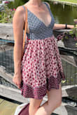 Fits really well - looks like picture. Felt slightly tight around bust, able to loosen slightly or tighten back of dress - Melissa N.
