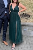 I'm 5'6 and ordered a medium. I did have to get a whopping 5 inches hemmed for it to sit just at my ankles while wearing heels. If you're ordering it for an event, make sure you order with enough time ahead to get it altered. Otherwise, the dress is absolutely gorgeous and worth the effort to get alterations. The double slit was sexy but still classy for a wedding. I got so many compliments that I looked like Feyre from the ACOTAR series, and if you know the books you know that's a serious compliment!! - Madison S.