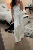 Bought this for my bridal shower. It is a very high-quality fabric and I don't have to worry about it being see-through. Fits perfectly! Photo is before steaming it- it does get wrinkly but steaming works really well. - Whitney A.