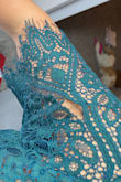 Beautiful color dress (I got emerald). I got tons of compliments. Wore it to a fall wedding and ordered a size small which I usually am (but sometimes more of a schmedium). Length was perfect. My only complaint is that I tried it on ONCE before wearing it to a wedding, and the second time I put it on I noticed a hole in the arm right when my Uber arrived to take me to the wedding. I was furious. The hole was a rip in the lace part of the sleeve and very obvious. I had to use thread to tie the hole together just so you couldn't notice it (the photo is with the thread attached). I am terrified to wash it because I know the hole will get worse. I was disappointed in the quality of the fabric for the price I paid. - Kristina C.