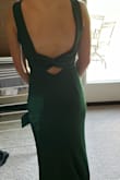 The fit is so perfect, what gives this dress the look is the open back with a bow across the bottom. - Jamie P.