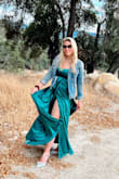 I had been eyeballing this dress for years and it would always sell out right as I was ready to take the plunge to buy it for a special occasion. 
It came back in stock just as I was shopping for a Vineyard wedding and it fit exactly what I had in mind! Love it. It is a satiny dress so any water or liquid you might accidentally spill sticks around for a while lol so don't mind the water spot on my chest. The slit also runs up high so just gotta be mindful when twirling it posing for pics - Amaris J.