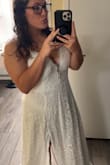 Bought this dress because my husband and I decided last minute to cancel our wedding and elope at the beach! I ordered based on the measurements chart and it was a little loose in the waistline but would not have changed a thing about it! Completely loved it! 
Side note: if you're short like me, it may be a little long! - Cassidy S.