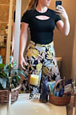 I really liked this top, but I went with the very similar, but sleeveless version. I'm tall with an extra long torso, and this fit comfortably. - Britt F.