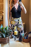 I don't often fit in bodysuits, but Lulus usually fits my long torso. Although this was a little snug and pulled, it TECHNICALLY fit, but the lace didn't extend down to the top of my pants like it does on the model, so it was awkward looking. Would have been cute though! I ended up keeping a different bodysuit. - Britt F.