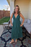 I originally ordered this dress in a medium but it was too tight around the chest. The large fit so much better. The front and back dip so low that I couldn't find a bra to wear that wouldn't show. Luckily the material is thick enough that I was able to tape myself into it without it looking too risque. I did need to use a steamer to get out wrinkles from shipping. I wore this to a military ball and got so many compliments all night long. - Sarah P.