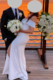 Wore it to my wedding reception and everyone loved it! I had it altered a tiny bit though... I raised the waistline to be more in line with my body shape and cut off a few inches from the bottom! The sleeves were a little restricting but that's expected for an off-shoulder dress. Overall a simple yet elegant dress for the occasion! - Mayra K.