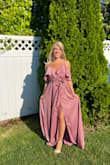 I wore this dress to an autumn wedding and everyone loved it! The fabric was very comfortable and felt great. I read the reviews ahead of time and knew that the dress would be too long for me (I'm only 5' 3") so I got it hemmed and took off 3 inches. I do wish I actually took off more inches and may get it hemmed again to take off another 3-4 inches. I also added in a hook on the front of the dress, since I had read reviews that the clasp on the top comes undone easily! I'd also recommend doing that and the hook worked great. - Caileigh F.
