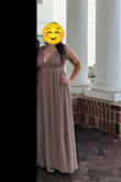 I got so many compliments on this dress. It is well made and beautiful. The taupe color looks different depending on the lighting. I was worried about how low-cut this dress is and how it would work with a larger bust size. But it looked great both with and without boob tape. I used some tape to feel more secure. This dress is really long, and someone shorter may need to get it hemmed. - Hannah T.