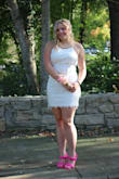 Even without sparkle or sequence, this dress was fun and definitely unique! No one in my school of 1600 wore this to homecoming! It shipped super fast, was great quality and stood out in a crowd. Color was a soft white, not cream or off white but also not super bright. It looked beautiful for the fall season. The details moved with the dress and were lots of fun. Paired with hot pink, it really popped. - Andrea F.