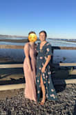 I wore this to a fall wedding and it was wonderful! Received lots of compliments and was comfortable standing, sitting, and on the dance floor. It is a long dress and just barely hovered over the ground when I was wearing heels, so with flats or for a shorter person it would drag on the ground if not taken up a bit.
I liked the wrap style and it made for a sexy slit in the leg while walking and for pictures, but for anyone attending an outdoor wedding, I would just warn you to be wary of the wind! The only ties that connect the two sides of the material are up on your midriff, which meant that any time a gust of wind blew at the outdoor wedding and reception, I had to grab on to the dress to make sure that the leg slit didn't open and show a bit too much. - Elise C.