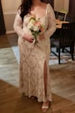I have a 50 inch booty so I had to get a 1x but I'm small from the top so I had to get my sleeves and waist taken in but such a beautiful dress and such great quality for the price! I felt like a beautiful bride in this for my backyard wedding. I would buy again in a heartbeat - Lesli B.