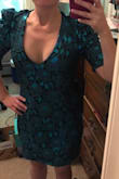 I love this dress!! I am not a person to usually write reviews, but it was hard to find a review for me to go off of! There was one girl similar measurements to me I went off of! I am 5 feet and 103 pounds! I am a 32 A in bra size! I ordered a small instead of my usual extra small! You definitely need to size up one size! I did have to get the sleeves taken in from the top so I was not worried about people seeing my bra and me having to try and fix myself all night! There isn't much give to this dress either so please be aware of that! Also it is more of a teal then a green! In my picture I have the sleeves pinned, as this was before I got it altered! I do truly love this dress though! - Marcelle B.