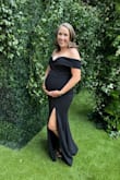 I got this to wear to a black tie wedding at 20 weeks pregnant. I got so many compliments. It hugged my bump so perfectly. The shoulder straps stay put and the slit is not too high but high enough. I can't say enough good things about this dress. Fit very true to size. I did size up maybe a couple of sizes due to my bump and growing boobs. If I weren't preggo I probably would have worn a small. - Kathryn B.
