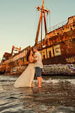 I bought this for my beach wedding in Greece but decided it was too sexy for my ceremony. It fit well and is 100% lined with a bodysuit. I decided to wear it in a "wreck the dress" photoshoot and went into the water with it. Fun! Afterward, I washed it in the sink and got all of the sand out, then had it professionally cleaned and it's as good as new! - Kimberley H.