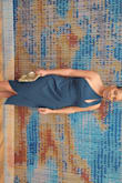 The dress was a "true to size" fit. I purchased a large. Although the color says, "Hunter Green," the dress looks blue. Overall, I definitely love it and received many compliments! - Sharna F.