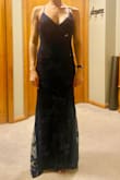 Very flattering! Nice and long only my toes will be showing, which is much better than most floor length dresses for my height! The cross cross back is a little difficult to get on solo, but very pretty once it's on! - Mackenzie S.