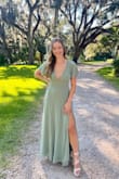 I wore 5.5' heels, but I had an alterations place take 3. of the dress because it drags on the floor with low heels. The color is very pretty & was perfect for the wedding I went to. Beware the dress needs to be steamed!! Hoping this dress will do me good in the long run. - Morgan L.