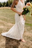 As soon as I put this on, I had that "this is the one" feeling. With some slight alterations*, it was PERFECT. It fit perfectly out of the packaging (except for length). It showed of my figured beautifully. I felt so effortlessly beautiful in this dress. Anytime someone complimented me on it on our wedding day, I couldn't wait to say, "Thanks! Can you believe it was only $89?!?!"

Not only is this dress gorgeous, but it's SO COMFORTABLE. I swear I could do high kicks in this if I needed to. It was the absolute perfect dress for an outdoor, mid-August wedding. 

*I had the dress shortened, a bustle added, taken down the back slightly (zipper shortened), and my mom added some pretty cording to the straps to get rid of the adjustable straps* - Lindsey H.