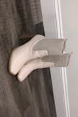 I love the look of these boots but unfortunately, after wearing them only for one night to a restaurant my feet rubbed against each other and the paint was quickly removed from the outside of the shoe revealing a tan undertone. - Carley S.
