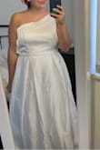 Honest review. I wanted to love this dress because I love one-shoulder dresses and who can beat this price for a wedding dress!? It would be a great option for other formal events - prom, cotillion, etc. just didn't have the wow factor I wanted for a wedding dress. The cups are very visible through the fabric and would've needed expensive tailoring to fix. Also, I would say the dress runs one size small - common for wedding gowns though.  I'm normally a 10-12 and would've wanted a 16 - the dress did not zip at all in the back. - Gabrielle G.