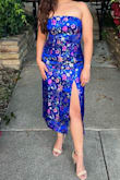 Beautiful dress with amazing details. The colors are vibrant and just as pictured. The length was perfect for me and the slit wasn't super high while standing. I knocked off one star mainly because the dress was VERY tight once you zip it and the elastic in the bust area kept folding over. The dress is more comfortable to stand in than to sit. I had to have a napkin over my legs while I sat because the slit was way too revealing while sitting down - Roxana A.