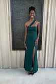The dress was absolutely beautiful and fit me like a glove. It was a little tight but I was still able to move with ease. The slit was also higher than I expected but it could be just because of my height. - Lyndsey S.